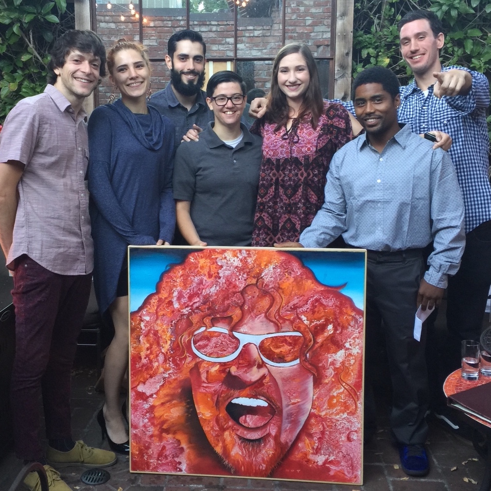 RAISING FUNDS A group from Ambassadors of Hope and Opportunity Project holds an auction item donated by Sammy Hagar. Left to right: Brett, Zoe, Benny, Jay, Larkin, Jimmy and Nick. Photo courtesy of Ambassadors of Hope and Opportunity.